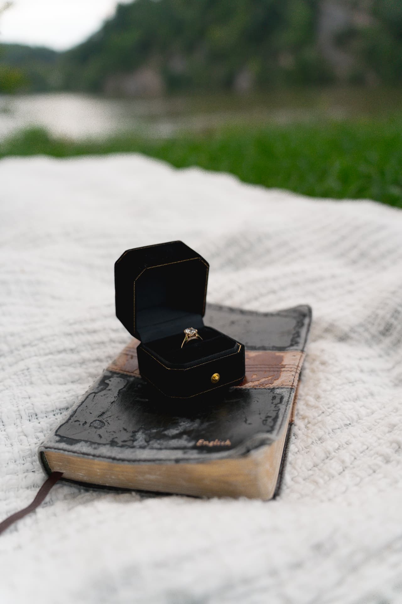 The engagement ring resting on a worn Bible