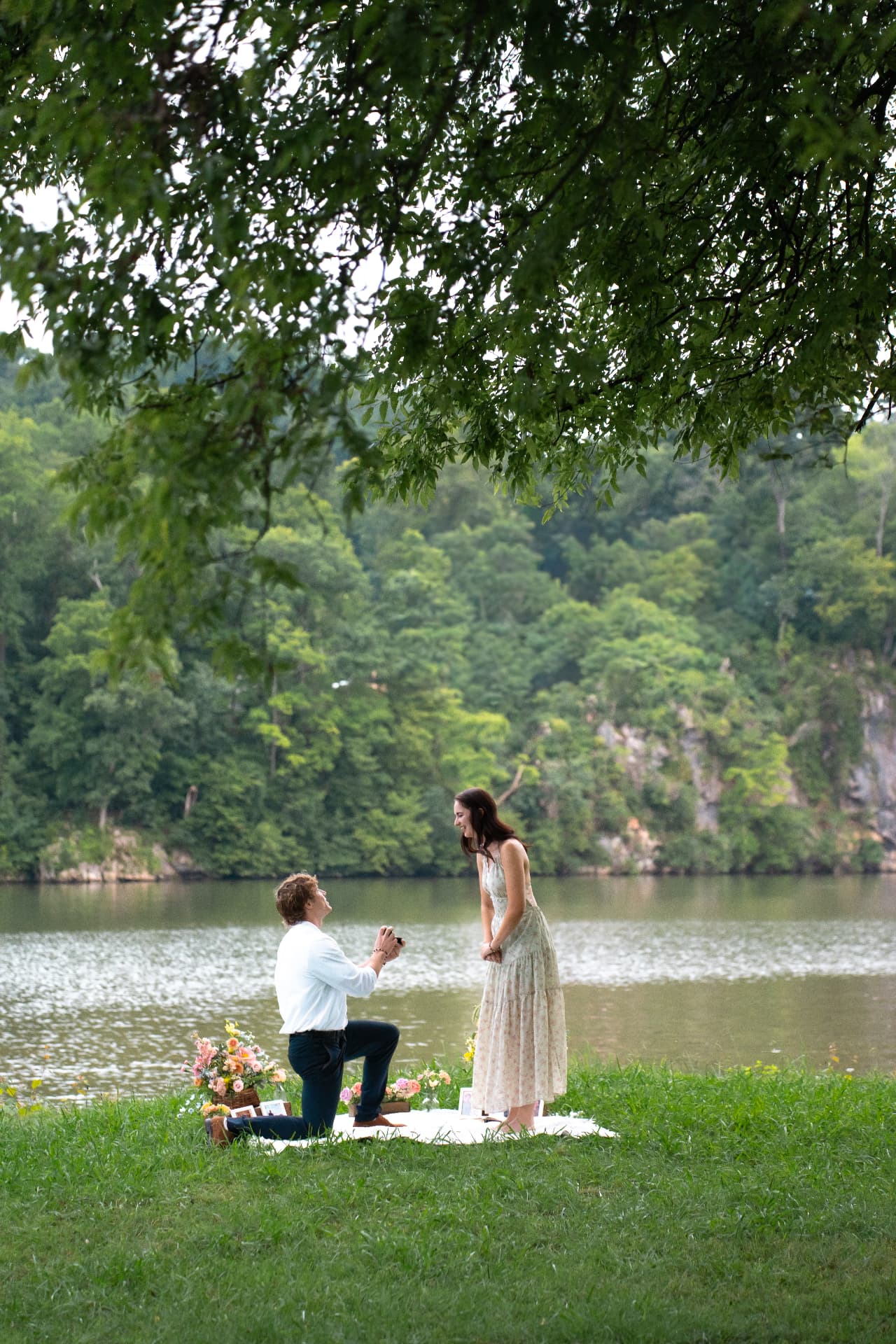 Zachary proposing to Simoné beside the river