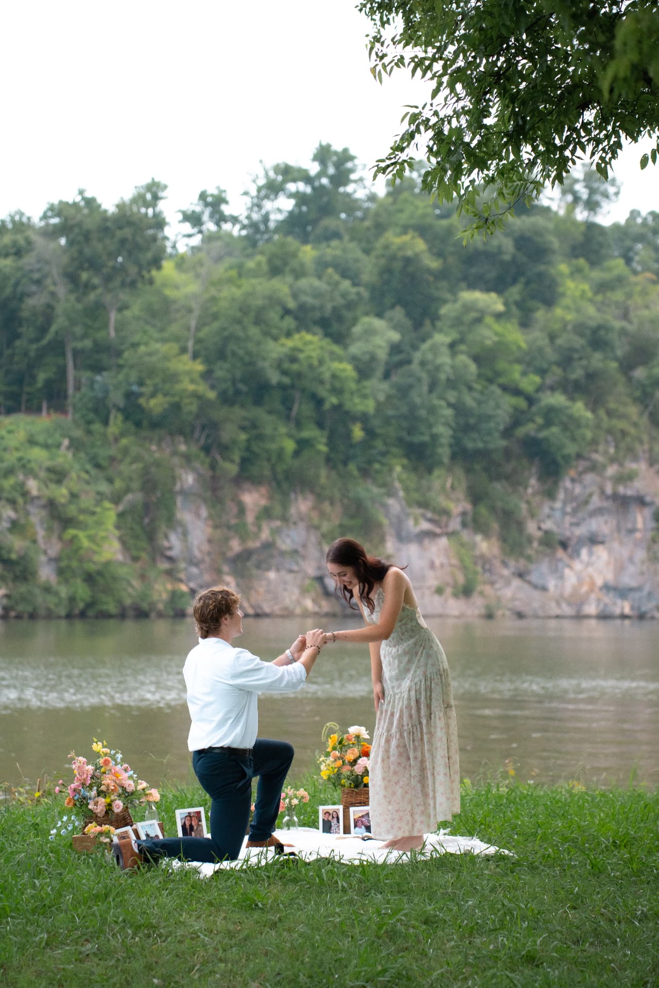 Zachary sliding the ring onto Simoné's finger